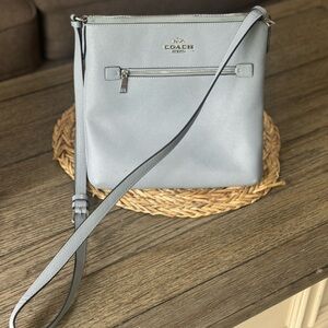 Powder blue Coach crossbody bag. Lightly used. No flaws.